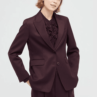 professional woman wearing wine-colored boxy suit