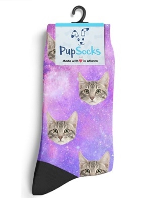 Galaxy-print socks with a gray cat face in a repeating pattern