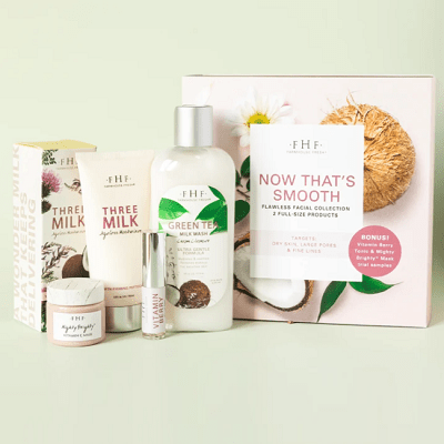 A skincare set of four products with floral packaging