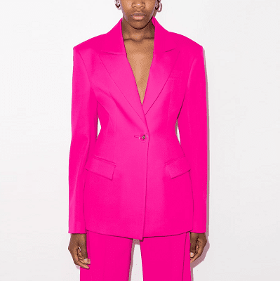 hot pink pants suit with bold shoulders