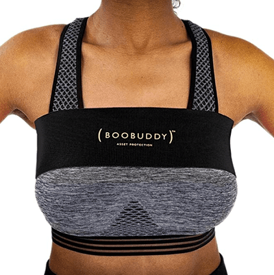 A woman (with head, arms, and legs cropped out) wearing a gray sports bra and black band over it 