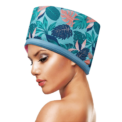 product image of a black woman wearing a teal blue shower cap with a Hawaiian print. 