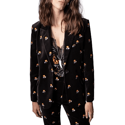 unusual black velvet suit with embroidered animals on it very rockstar worn with lacy camisole