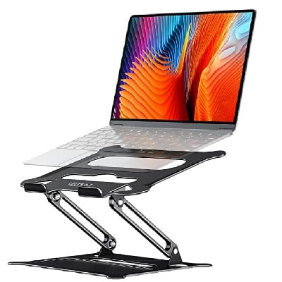 A black metal laptop stand with a laptop on top