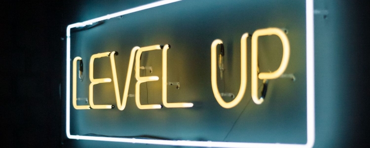 neon sign reads "LEVEL UP" in yellow with a white box around it