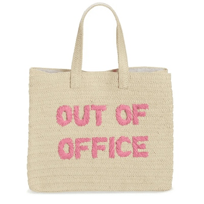 A beige straw tote with pink text 