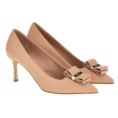 A pair of dark beige pointed-toe pumps with a folded bow at the toe