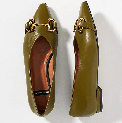 olive green leather flats with a prominent buckle