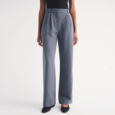 woman wears stylish blue wide leg pants