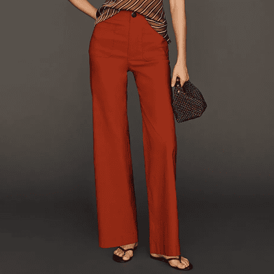 woman wears stylish orangey wide leg pants with prominent patch pockets