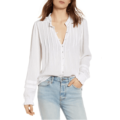 woman in white peasant blouse with pintuck details