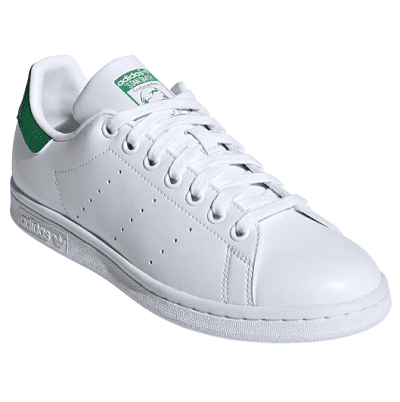 white sneaker with green details at heel and tongue