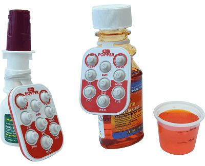 a keychain-sized bubble-popper with days of the week that can attach by rubber band to a nasal spray, liquid medicine (both pictured), or pill bottle (not pictured)