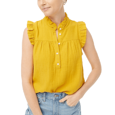 woman wears yellow gauze sleeveless top with ruffleneck and smocking details