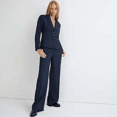 woman wears navy suit with three buttons