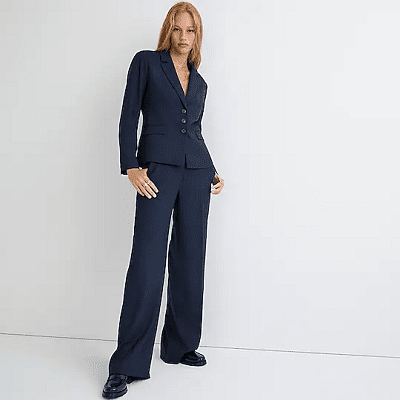 woman wearing a three-button navy blue suit