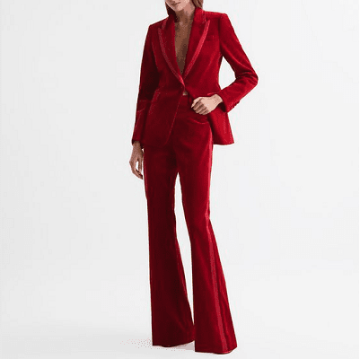 red velvet pants suit with flared pants; collar has sharp notch lapels and one button; there is a bit of a lighter pink detailing on the lapels