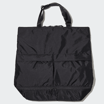 black nylon bag with two pockets on front; the picture shoes a short tote strap at top