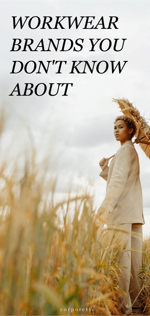 Pin reads WORKWEAR BRANDS YOU DON'T KNOW ABOUT; the background is a young professional woman wearing a suit stands in a cornfield -- she is off the beaten path