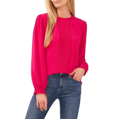 Pink Crisp pintuck pleats top with ruffles at the collar and billowy smocked-cuff sleeves.