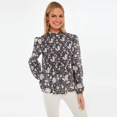 black and white print blouse with pintuck details and a mock neck