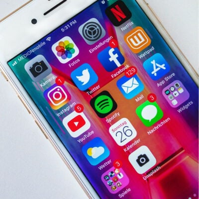 close up of the white iPhone screen with social media apps visible