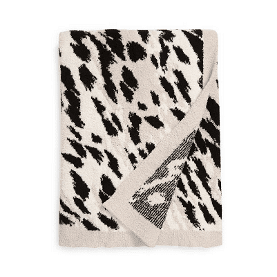 gray beige black throw with a slight animal print