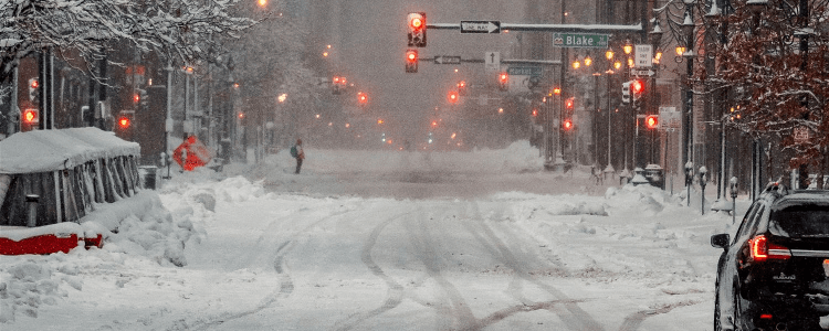 empty city streets covered in snow and slush