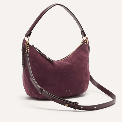 dark "red" bag with hobo crescent shape and both a shoulder strap and detachable crossbody strap
