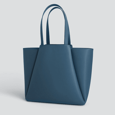 dusky blue leather tote with leather folds in a trapezoidal shape