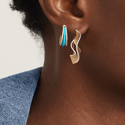 gold earrings with diamond and turquoise patterns