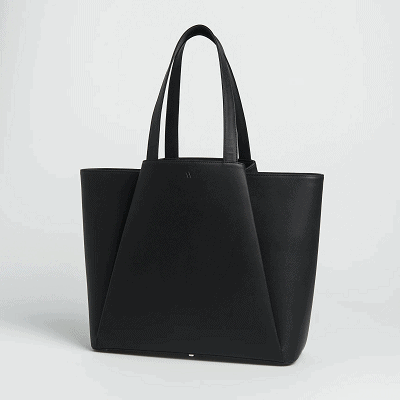 black tote with folded leather to make a trapezoidal/pyramid shape