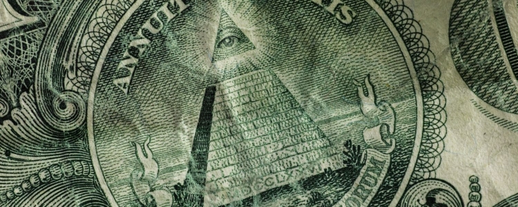 close up of a dollar bill, specifically the back side of the Great Seal of the United States