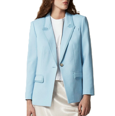 professional woman wears pale blue suit