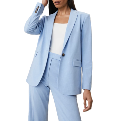 businesswoman wears light blue suit