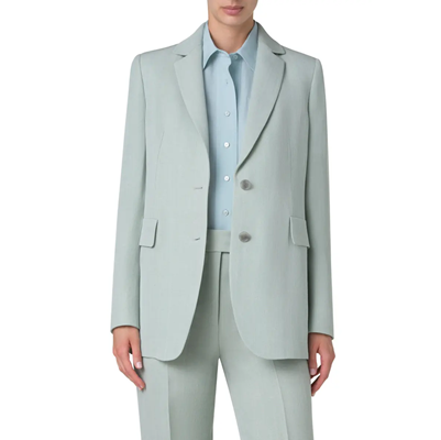 businesswoman wears light blue suit