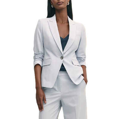 businesswoman wears light blue suit