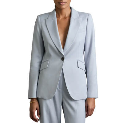 businesswoman wears light blue suit