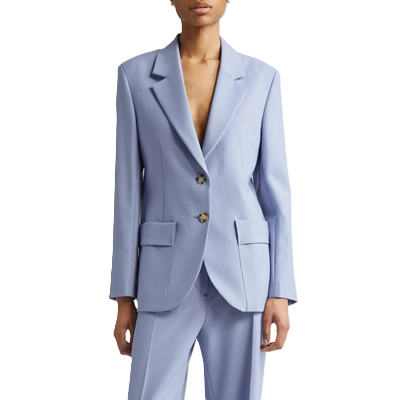 businesswoman wears light blue suit