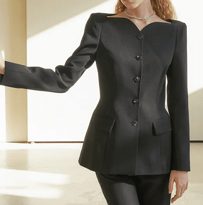 woman in black suit with interesting neckline