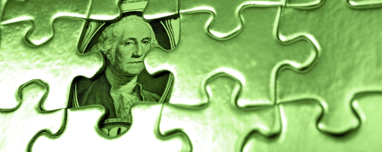 shiny green puzzle with hidden money beneath puzzle