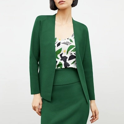 woman in green sweater jacket with matching knit skirt