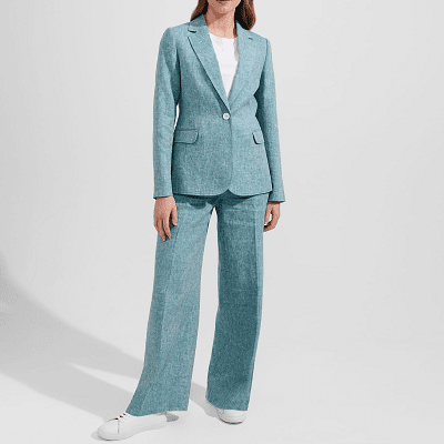 woman in light blue green pants suit and white sneakers
