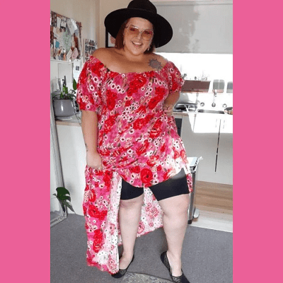 plus-sized woman in red dress shows off her cooling shorts