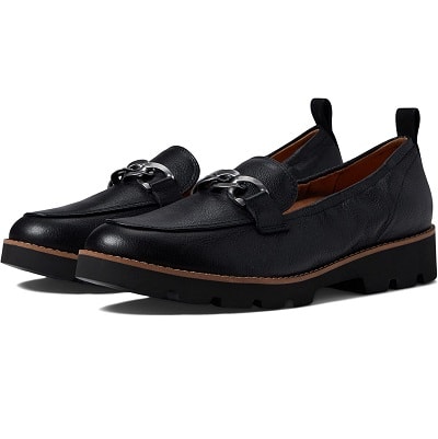 black loafers with brown detail around sole and silver charm on vamp