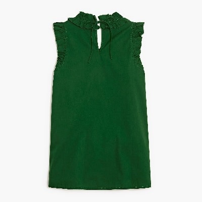 A green sleeveless ruffled top