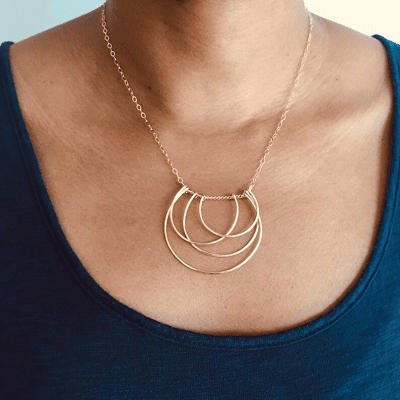 Art Deco-inspired necklace with overlapping horseshoes of different sizes