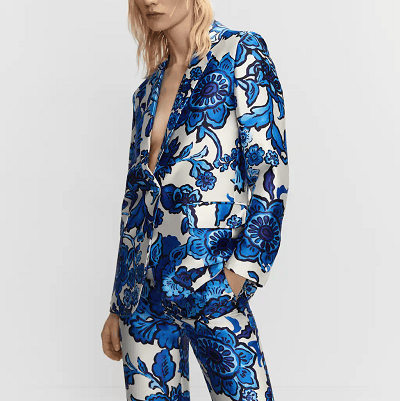 satin blazer with large blue floral print on it