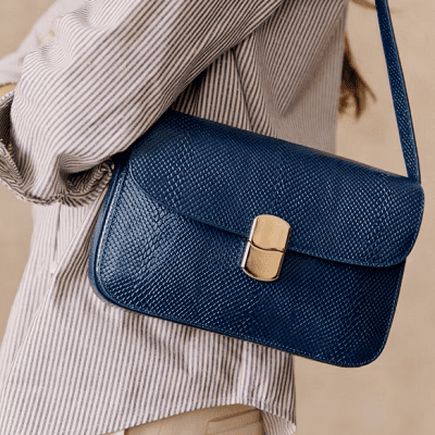 boxy blue shoulderbag with snakeskin embossing