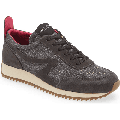 black and gray sneaker with red inner lining and white/beige sole